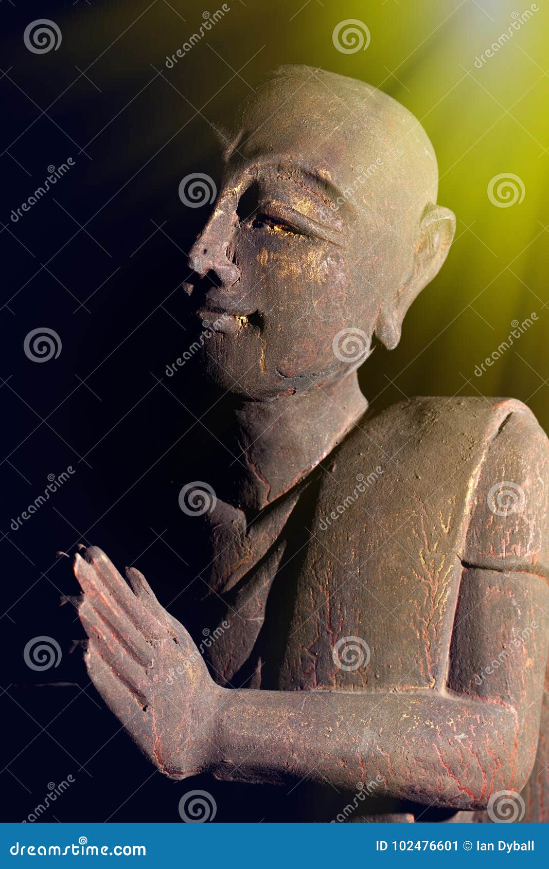 divine light of spiritual awakening. buddhist monk in serene prayer pose.