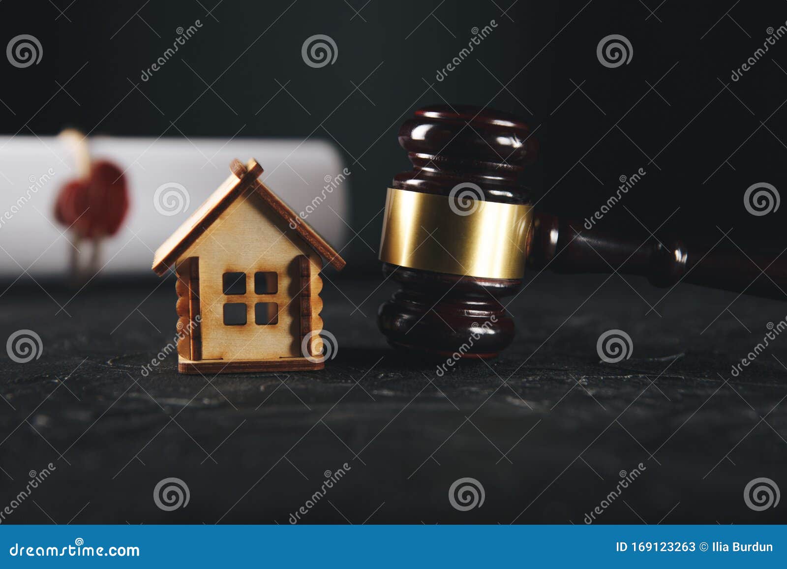 the division of property concept. wooden gavel and house  at the desk.