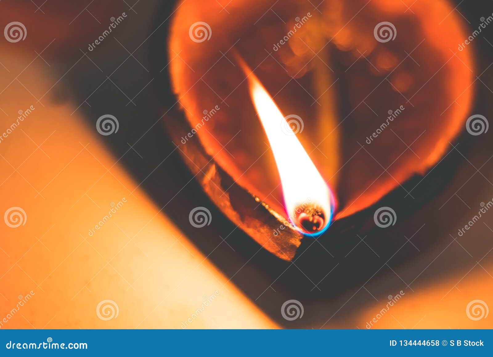 diwali oil clay lamp also called aladdin lamp on a dark orange black backgrounddiwali oil clay lamp also called aladdin lamp o