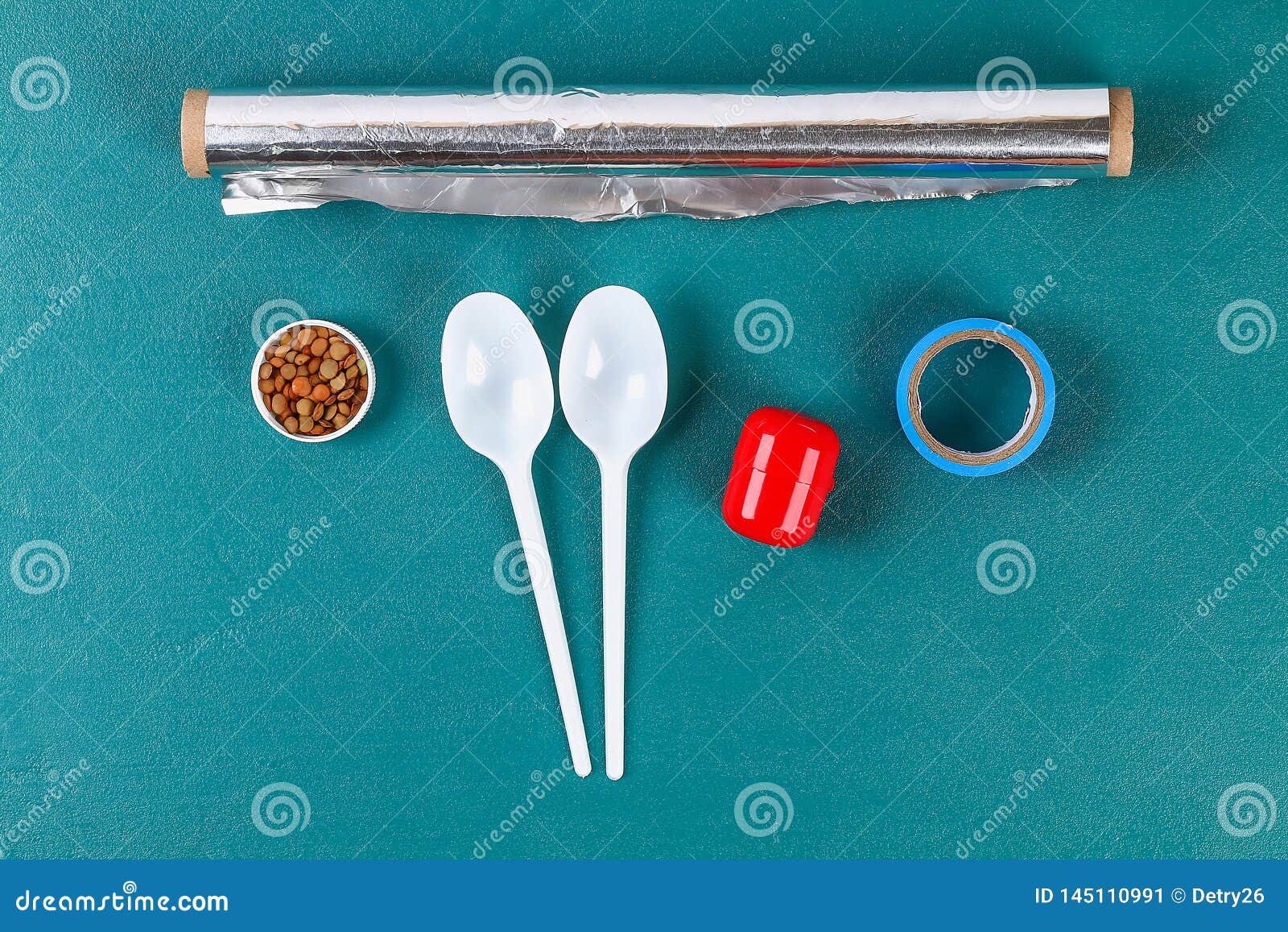 diy cinco de mayo maracas from eggs, spoons and cereals on a green background