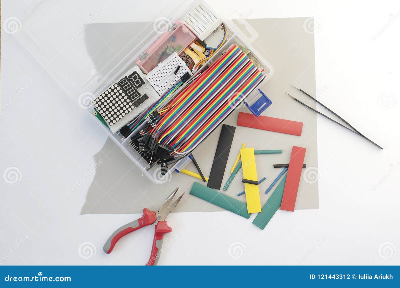 DIY Electronics Hobby Kit Opened Heatshrink Laying Around On The Grey