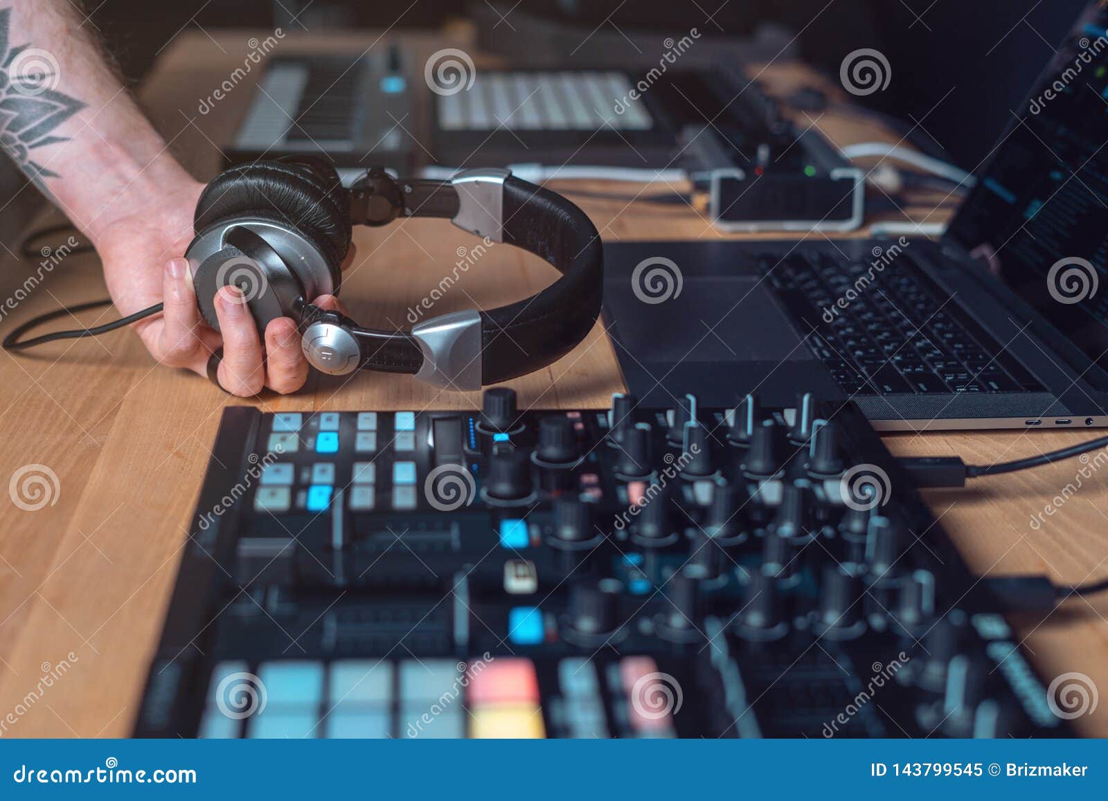 dj adult man creates electronic music studio cropped photo tattoo hands headset professional disc jockey records 143799545
