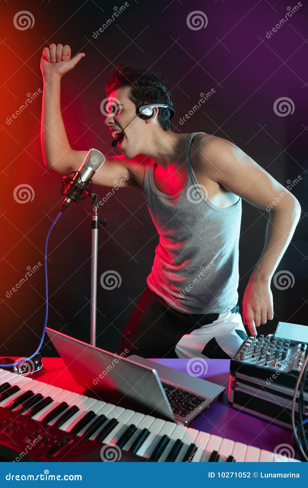 Dj with Colorful Light and Music Mixing Equipment Stock Photo Image