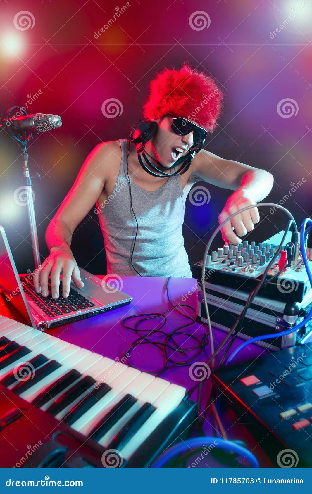 Dj with Colorful Light and Music Mixing Equipment Stock Image Image
