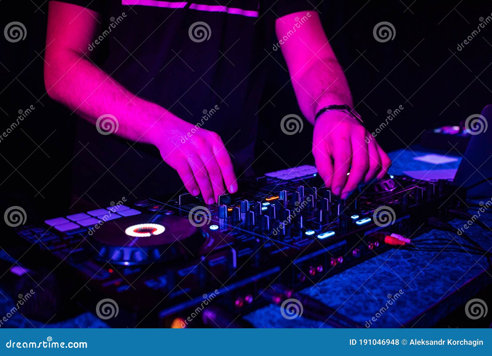 DJ Mixes Electronic Music with His Hands on a Music Controller Stock