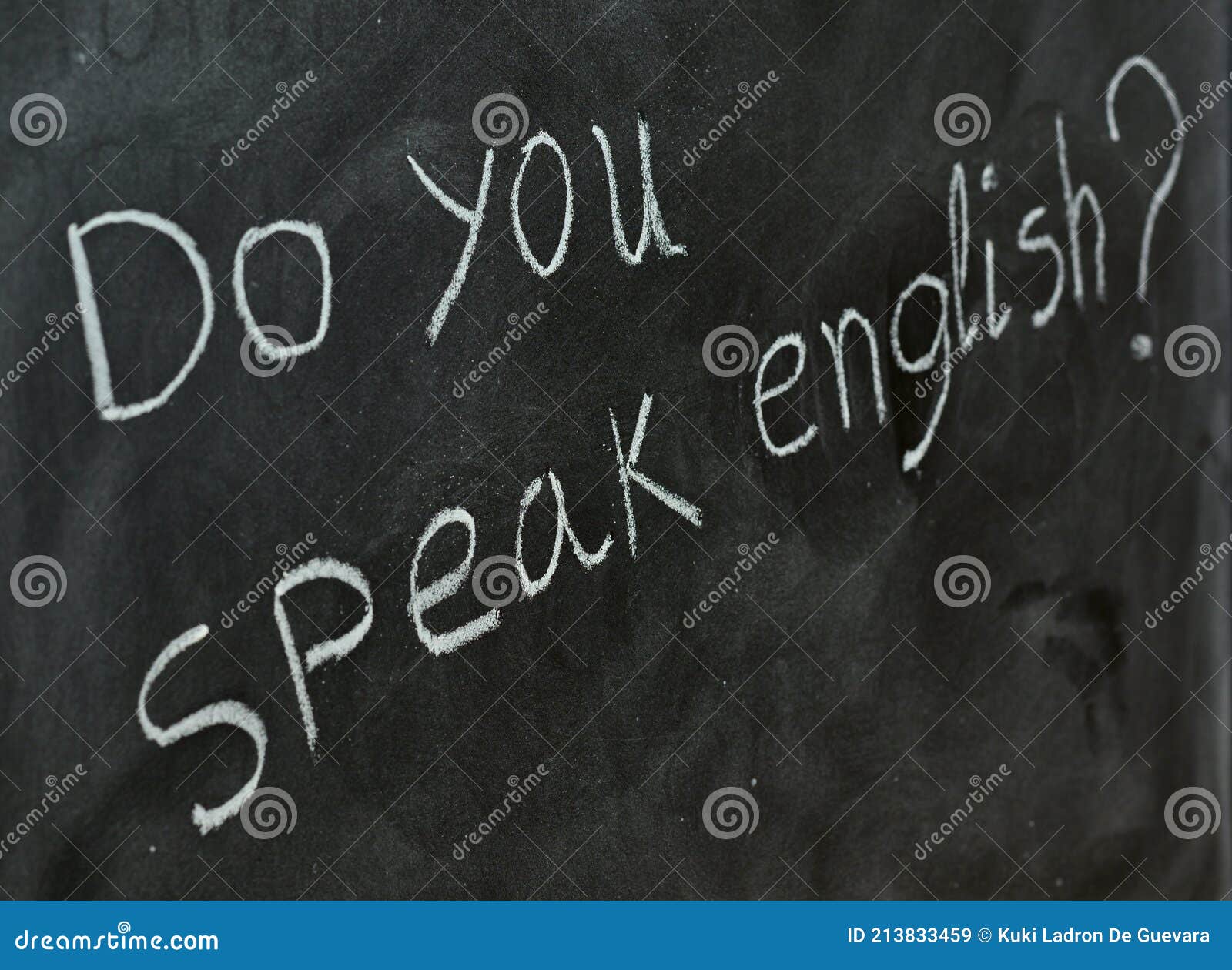 do you speak english, written on a blackboard