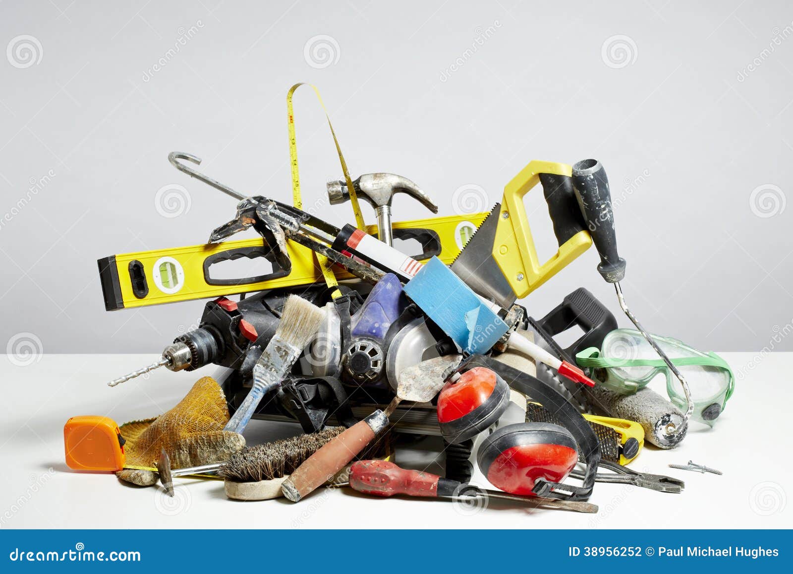 do it yourself tools in pile on white background