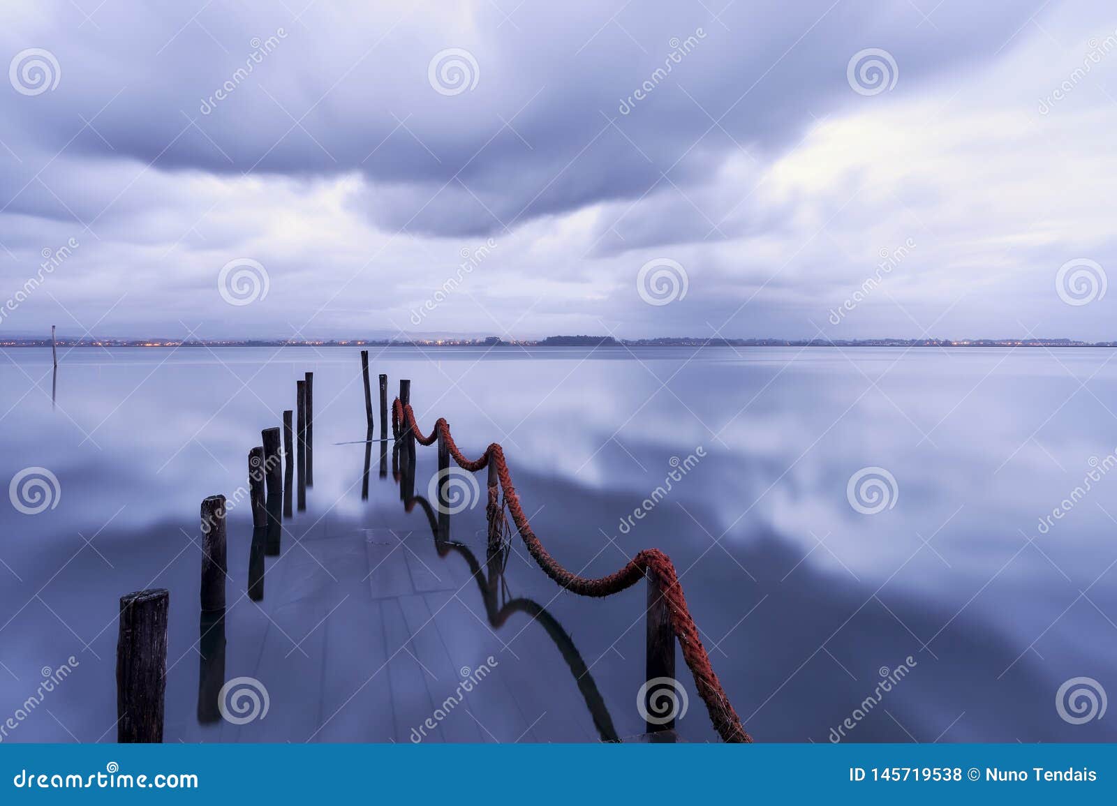 dock disappear into the lake reflecting waters