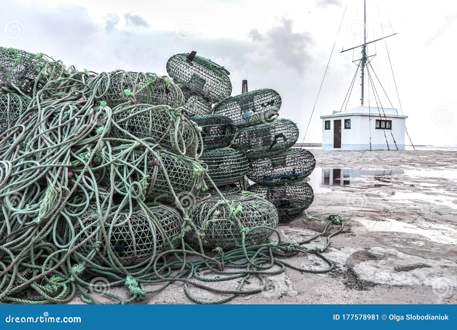Dock Littered With Empty Fishing Baskets Near A Small Building Stock Image - Image of building ...