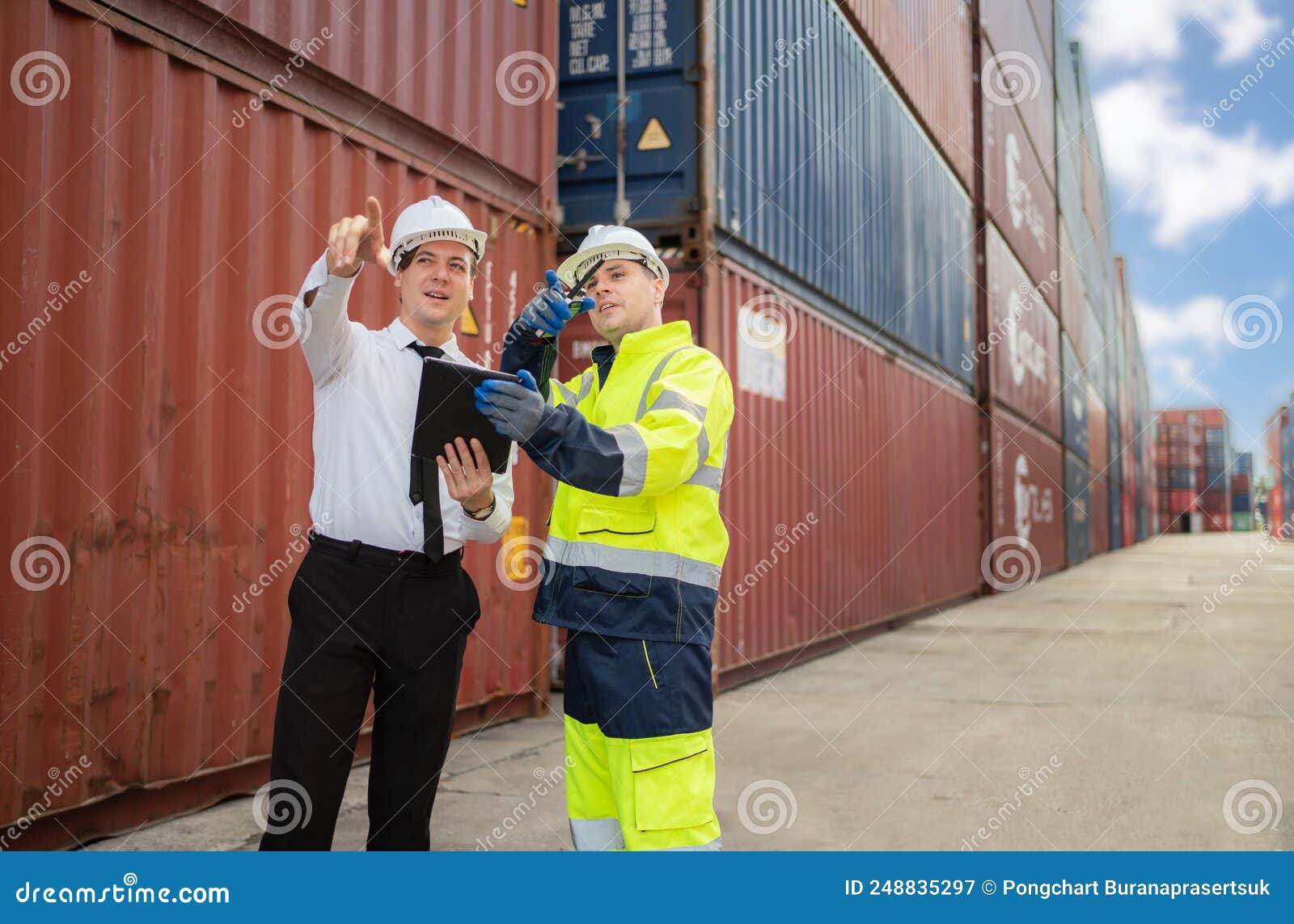 Dock Manager and Engineer Worker in Safety Helmet Point To the