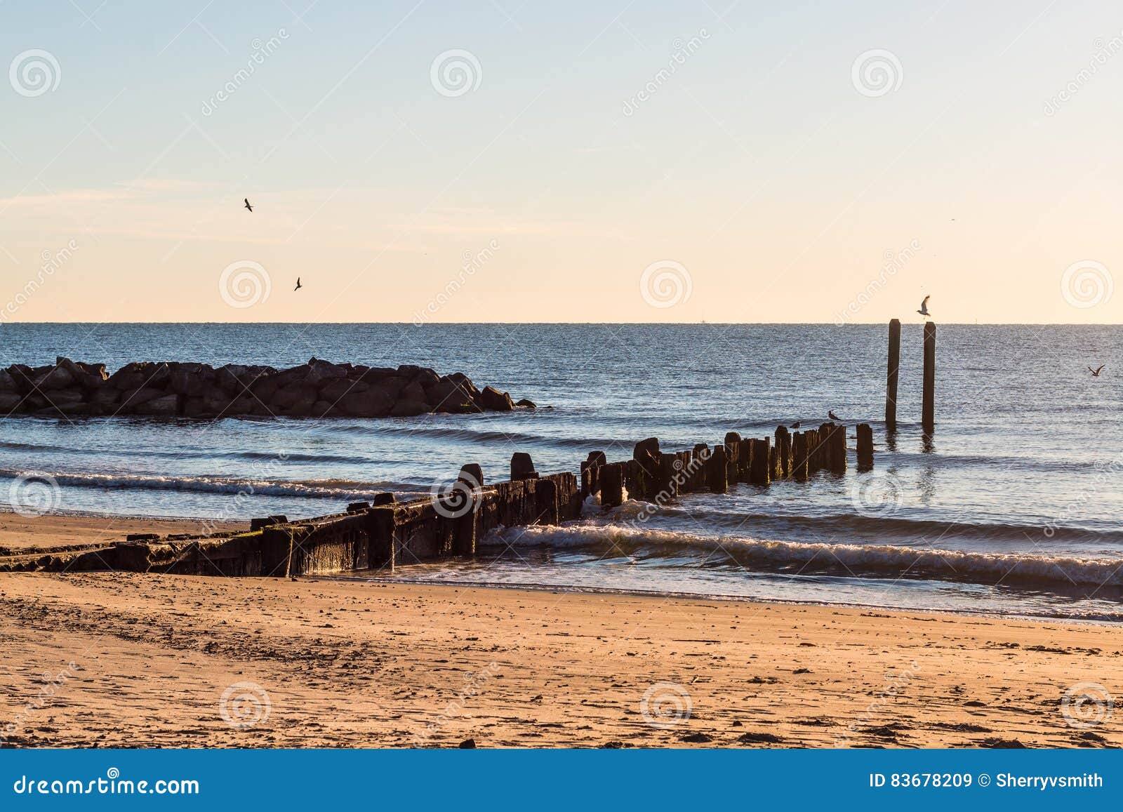 Dock Pilings And Rock Jetty At Buckroe Beach Stock Photo 83678209