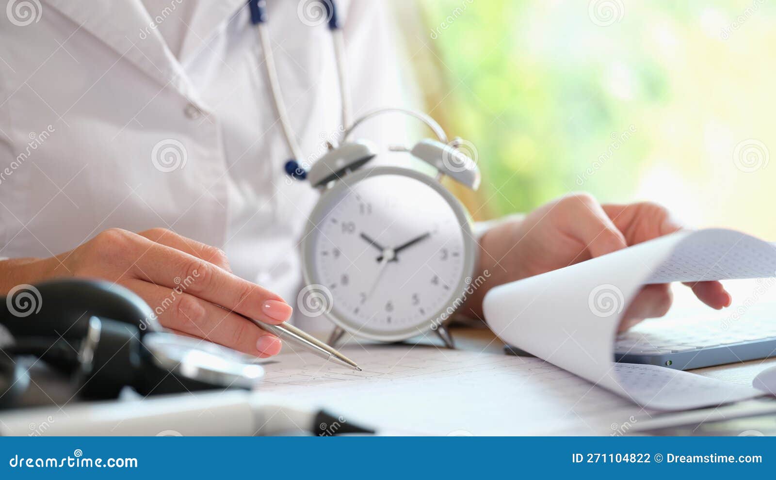 Doctor with Alarm Clock and Documents on Hospital Table. Stock Photo Image of wait, busy