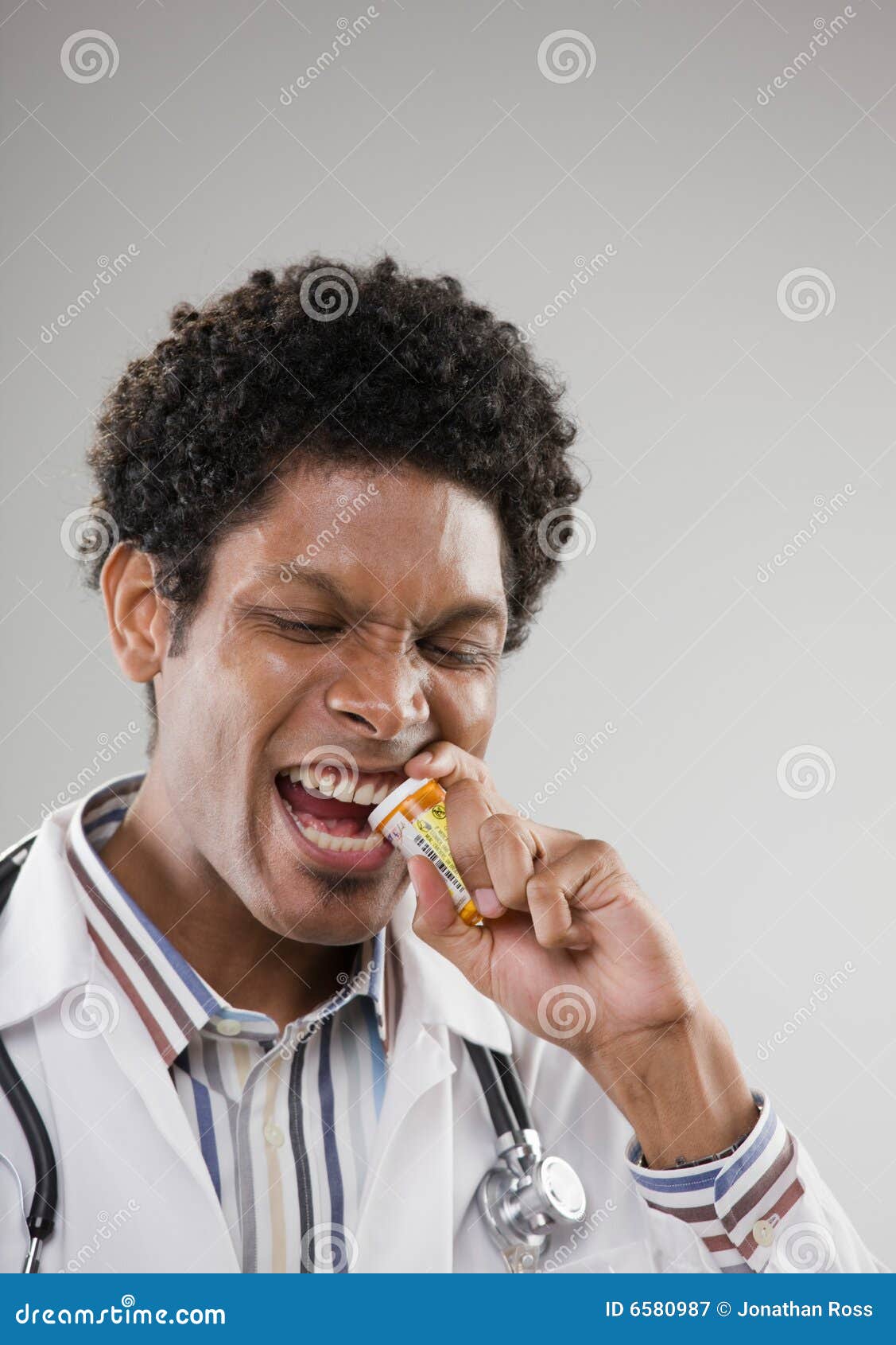 Doctor Biting Off Lid of Prescription Bottle Stock Image Image of