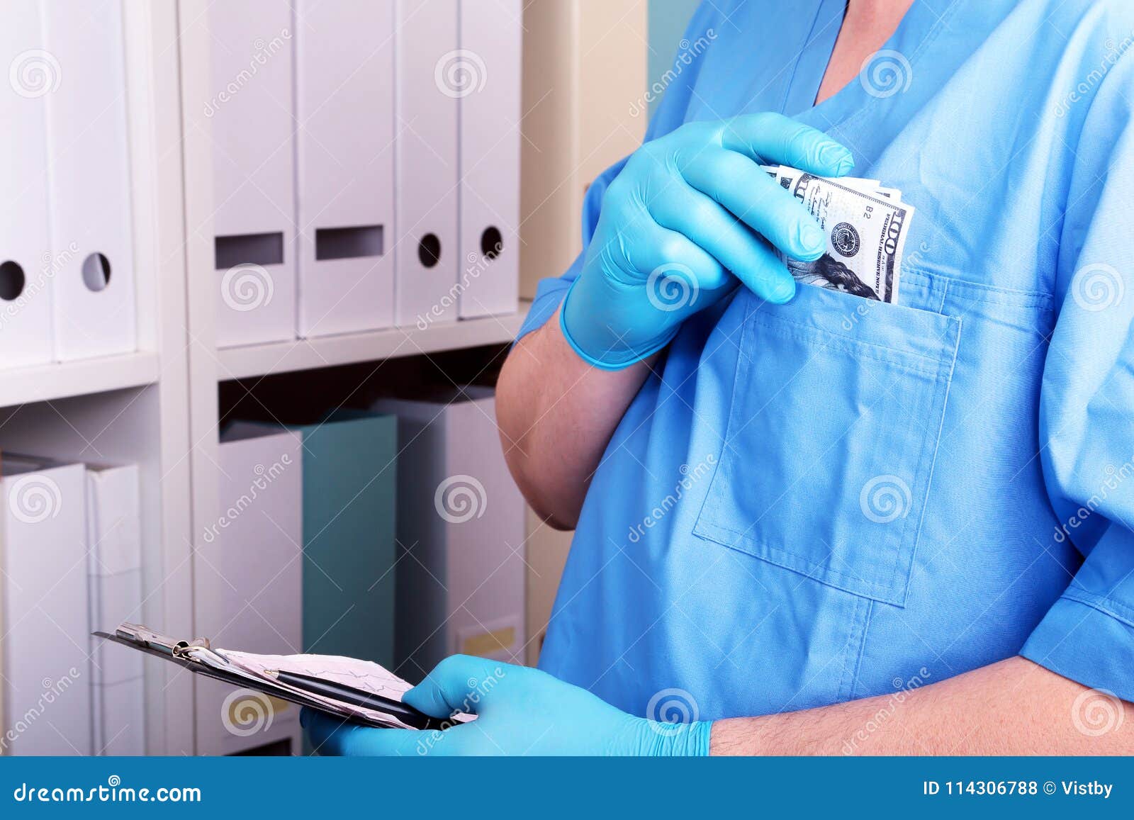 doctor in a blue uniforme write to the blank on a background of a shelf with folders. bribery and corruption concept