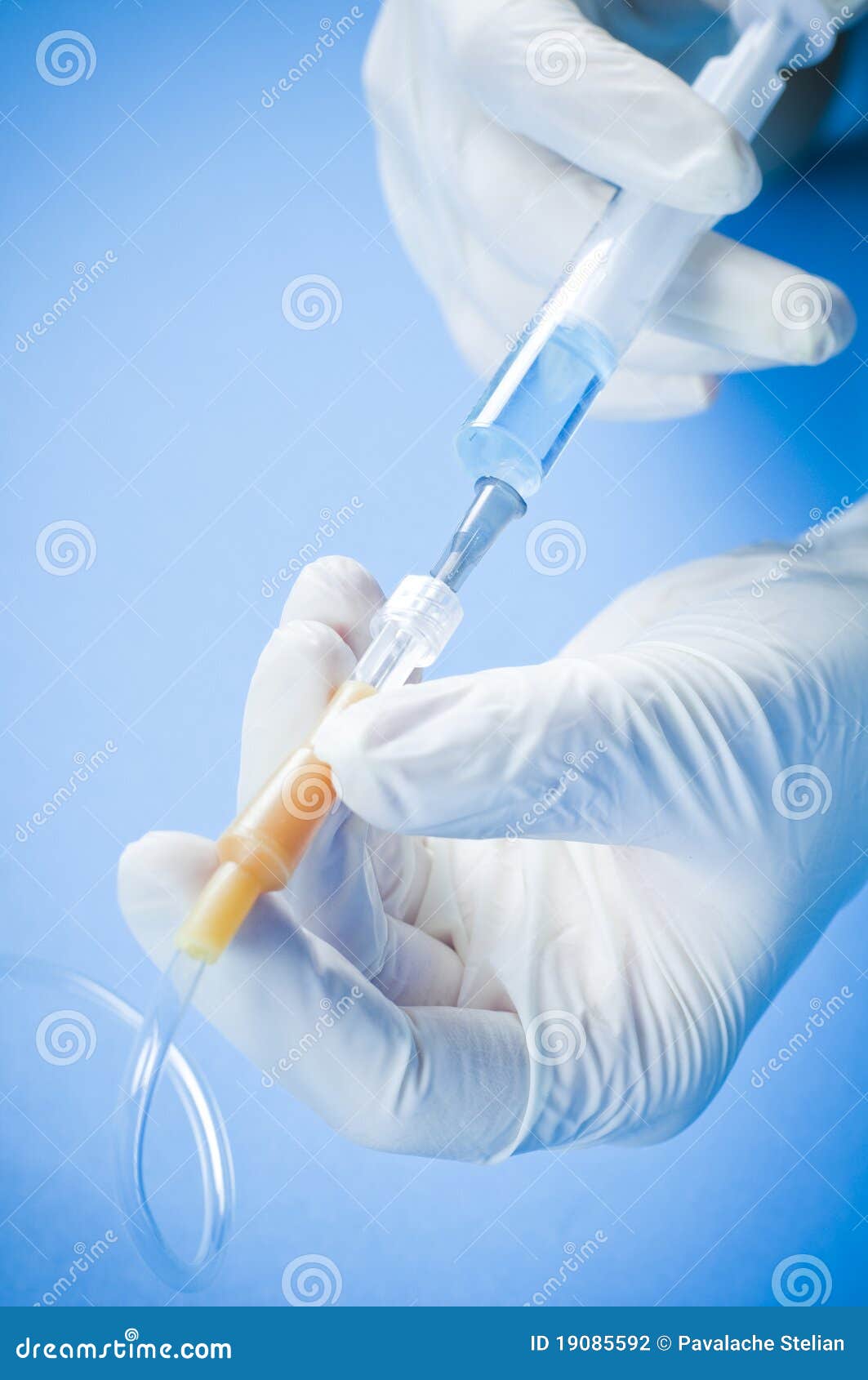 doctor with catheter and syringe
