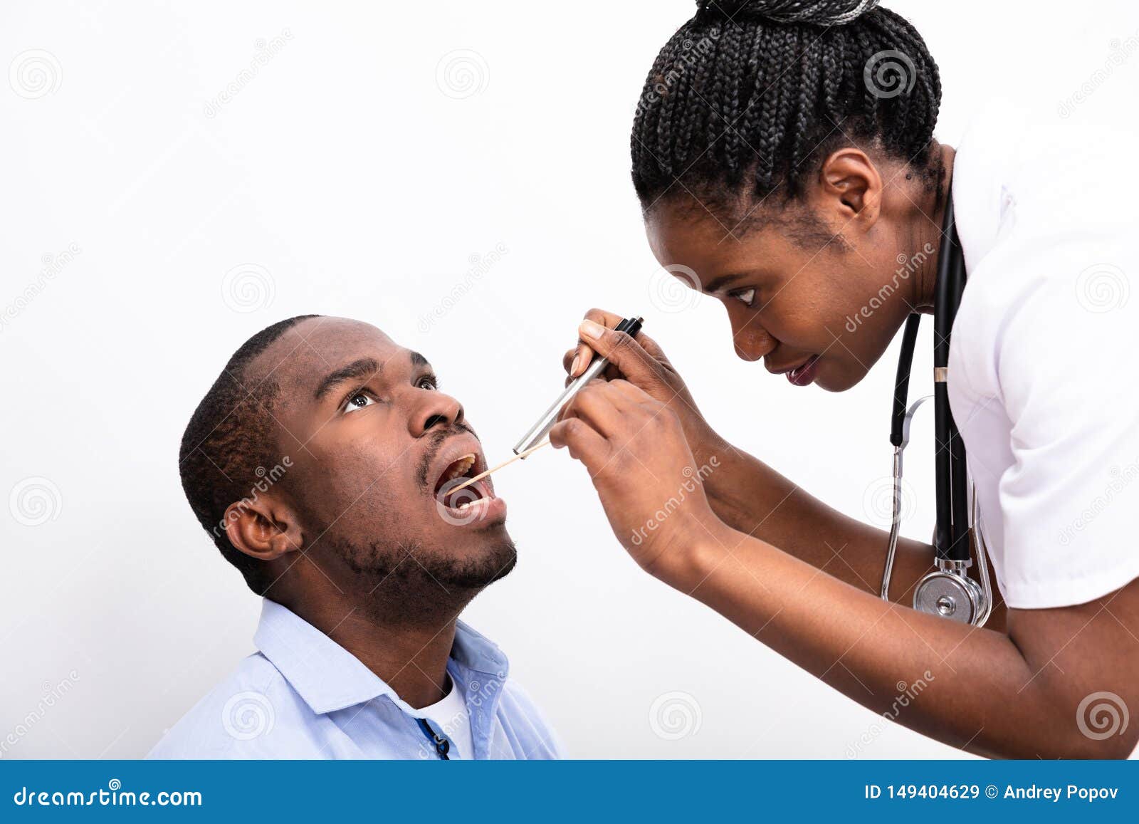 doctor checking man`s sore throat