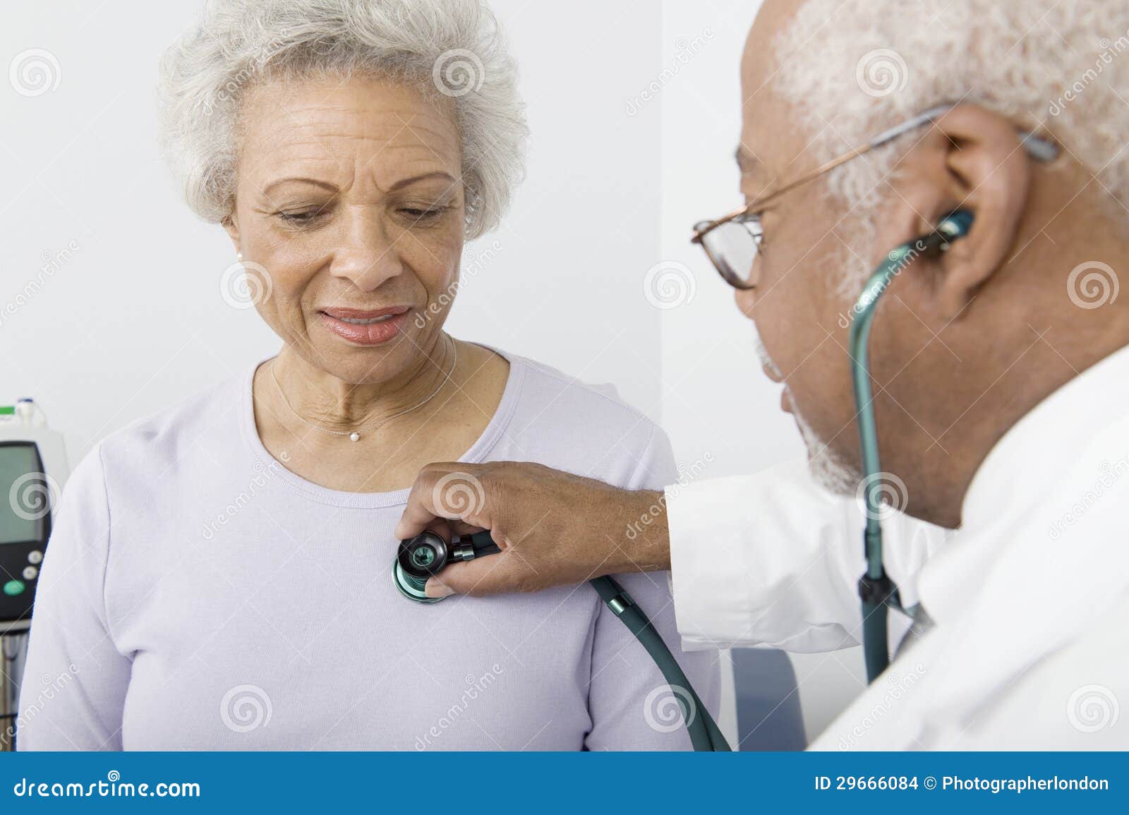 doctor checking patient's heartbeat using stethoscope