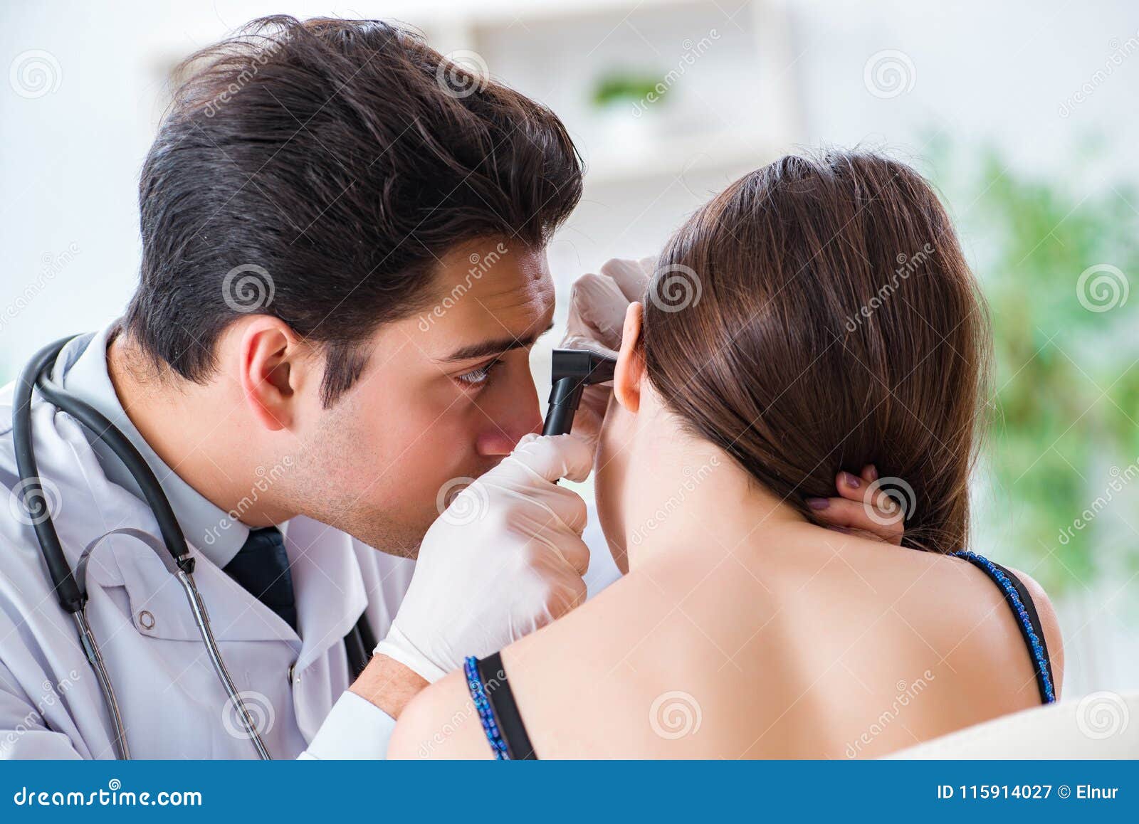 The Doctor Checking Patients Ear during Medical Examination Stock Image