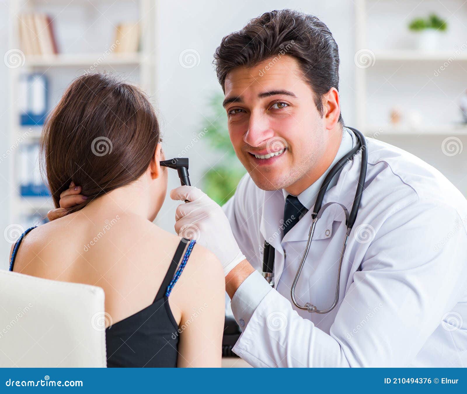 Doctor Checking Patients Ear during Medical Examination Stock Photo
