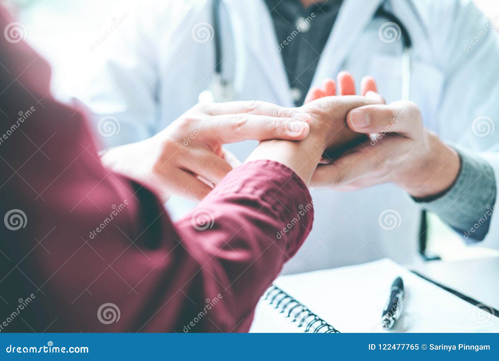 doctor checking pulse for patients health care in hospital