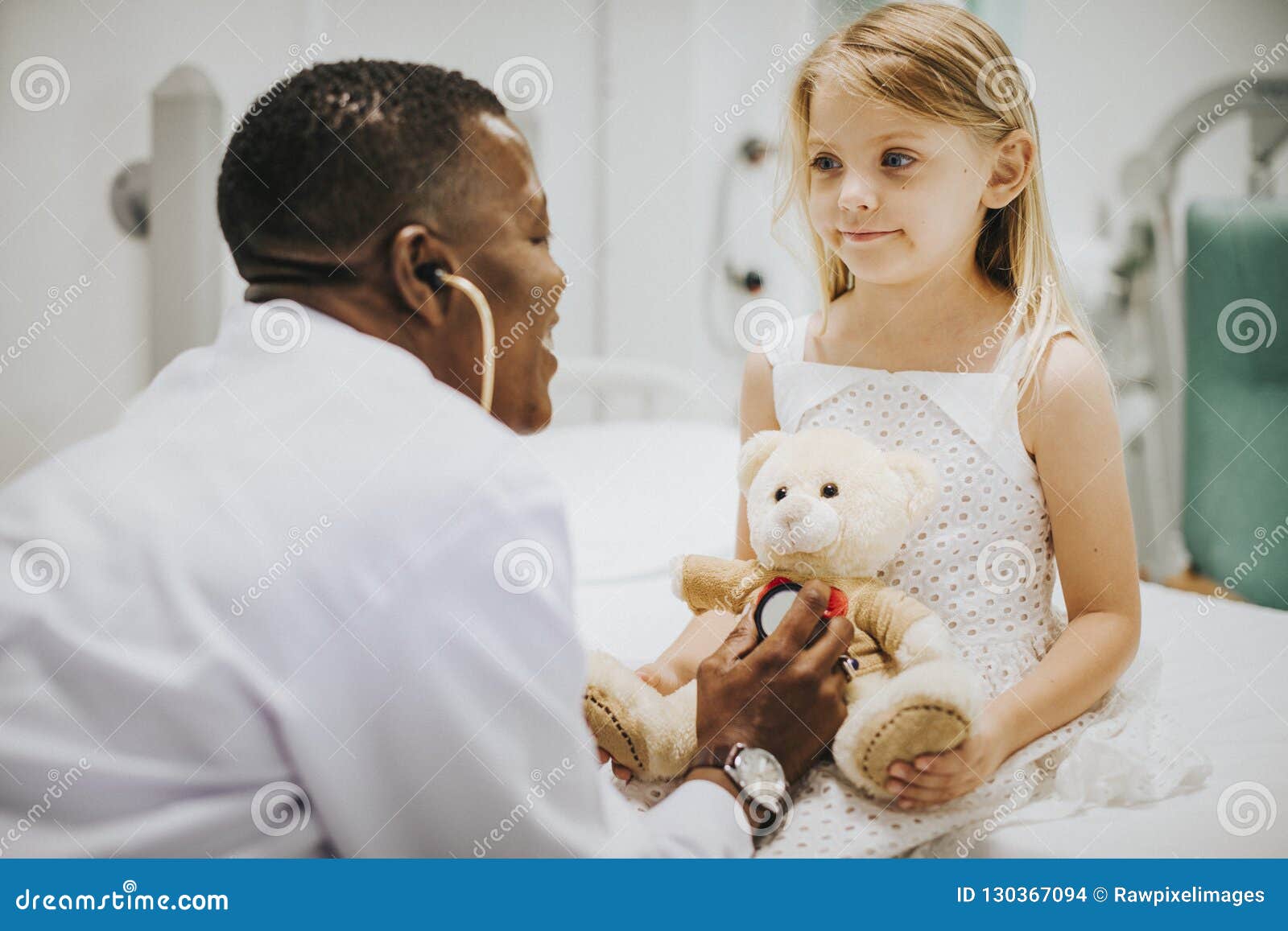 doctor doing a health checkup on a teddy bear