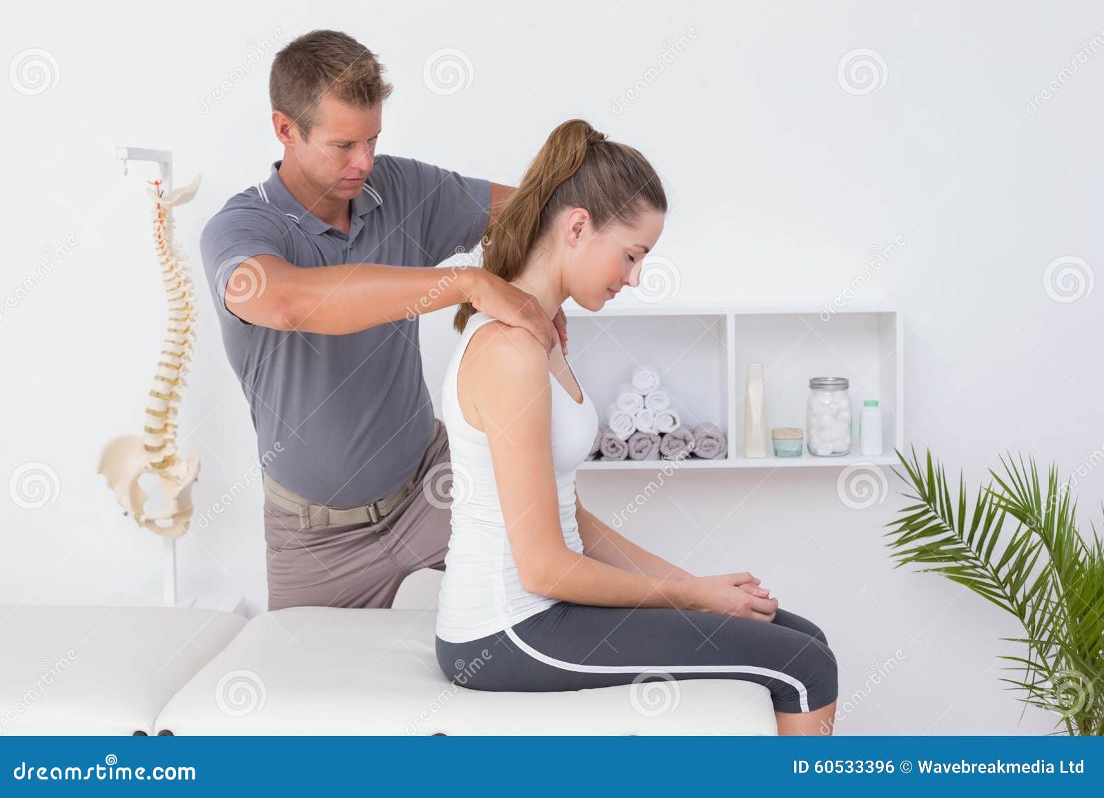 doctor doing neck adjustment