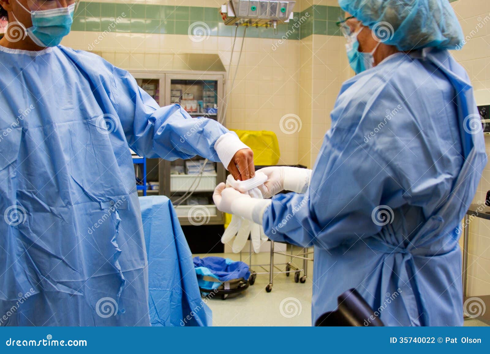 Doctor Donning Gloves For Surgery Stock Photography Image 35740022