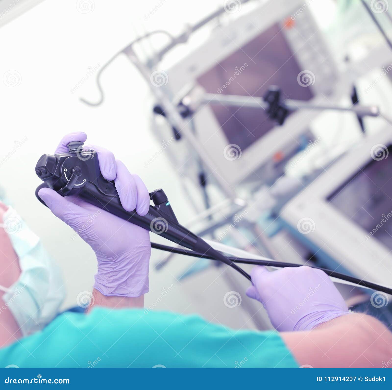 Doctor with Endoscopy Tool in His Hands during Procedure Stock Image