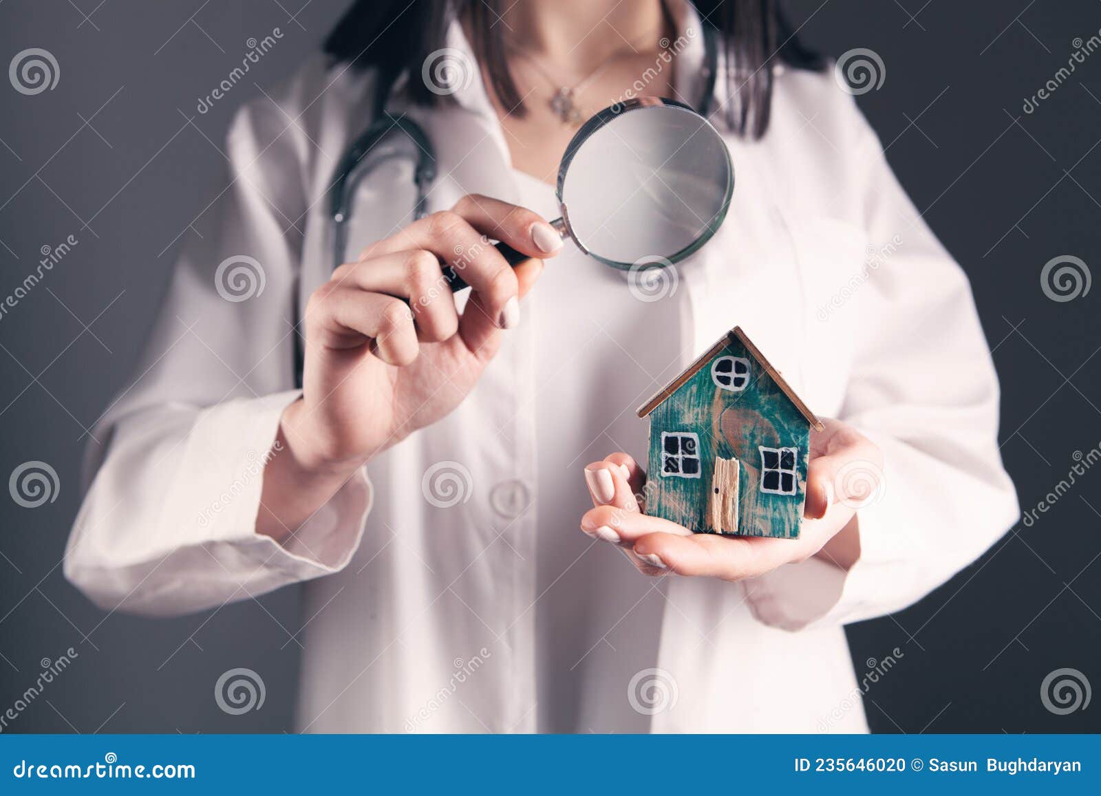 Doctor Examines the House with a Magnifying Glass Stock Photo Image