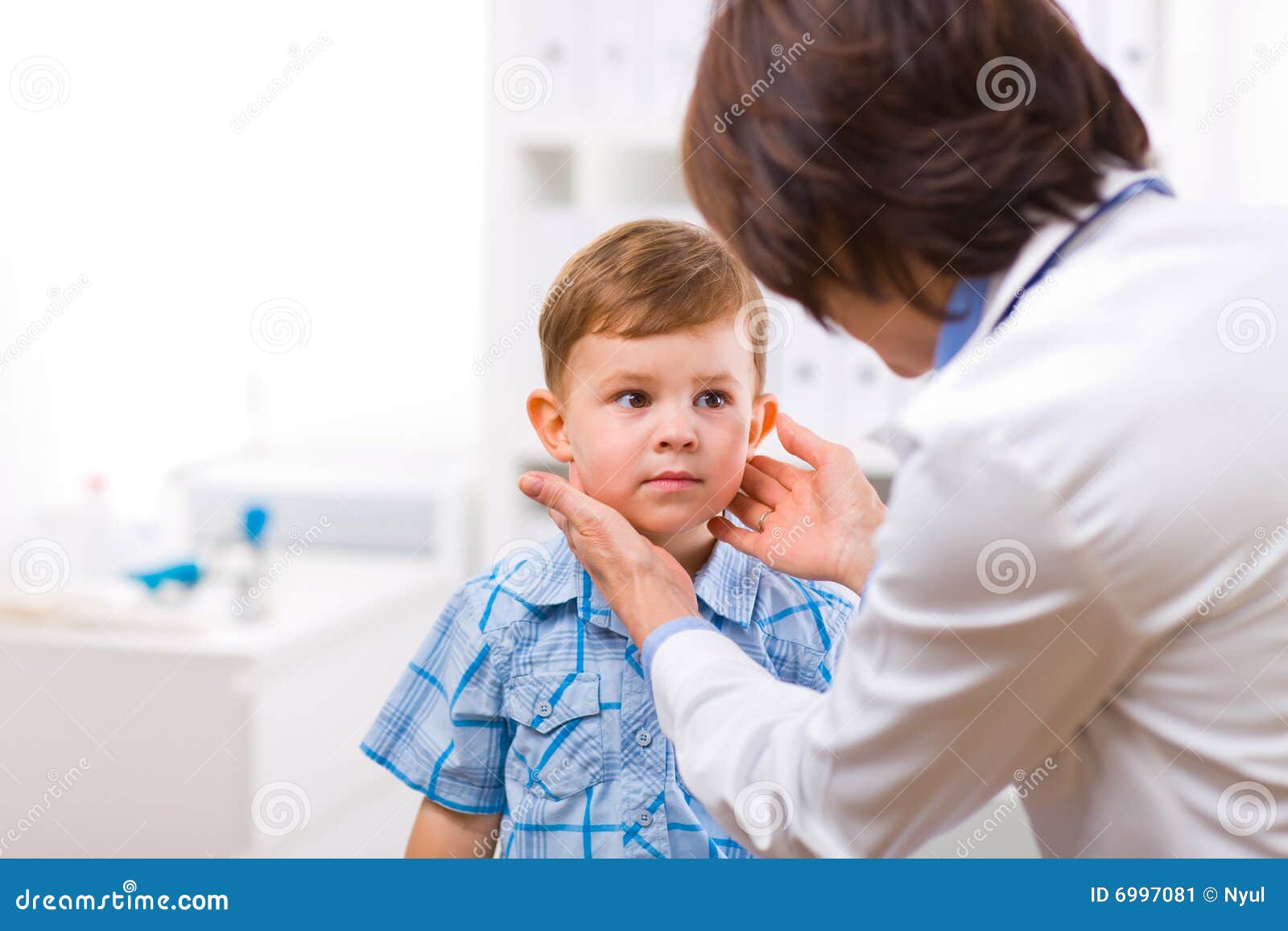 doctor examining child