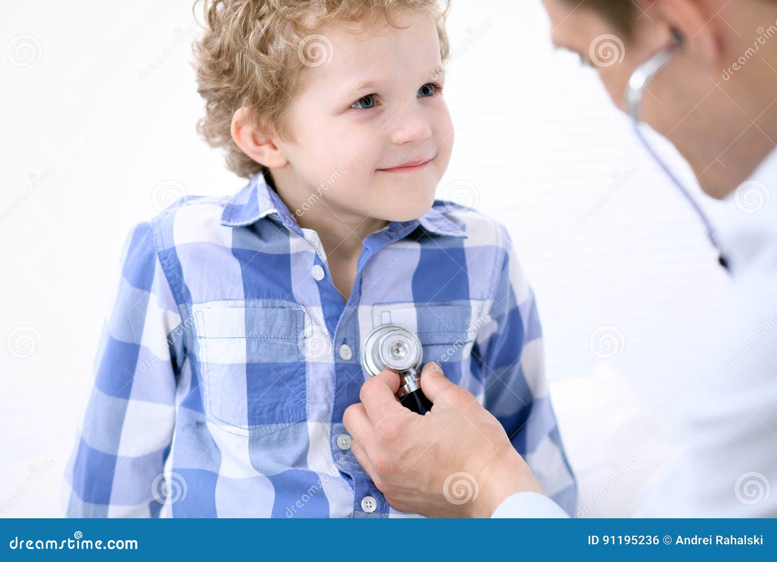 Doctor Examining a Child Patient by Stethoscope Stock Photo Image of