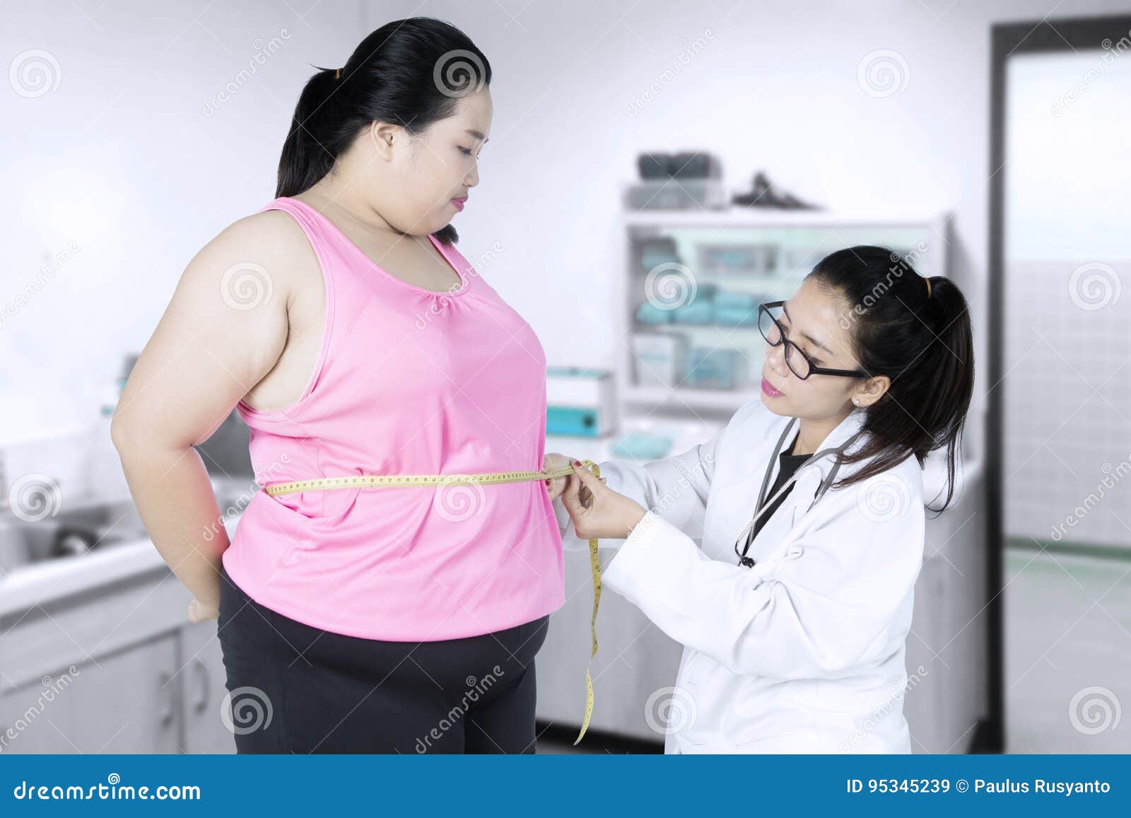 doctor examining a patient obesity