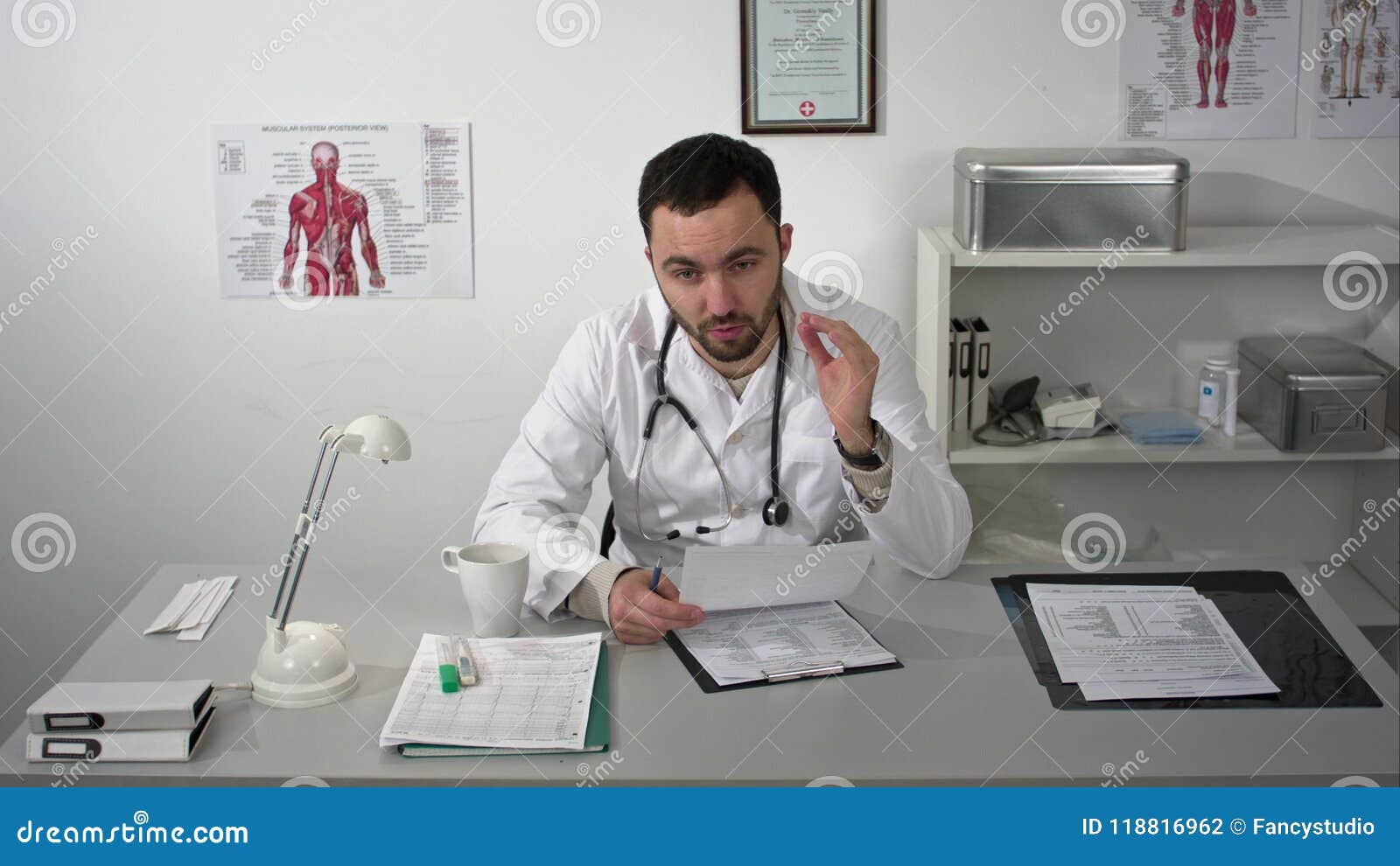 Doctor Explaining at Camera in Medical Office Stock Photo Image of care, health 118816962