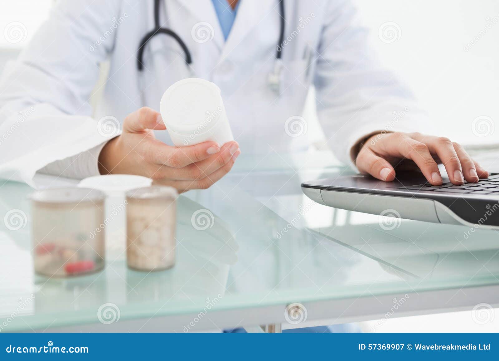 doctor filling out prescriptions