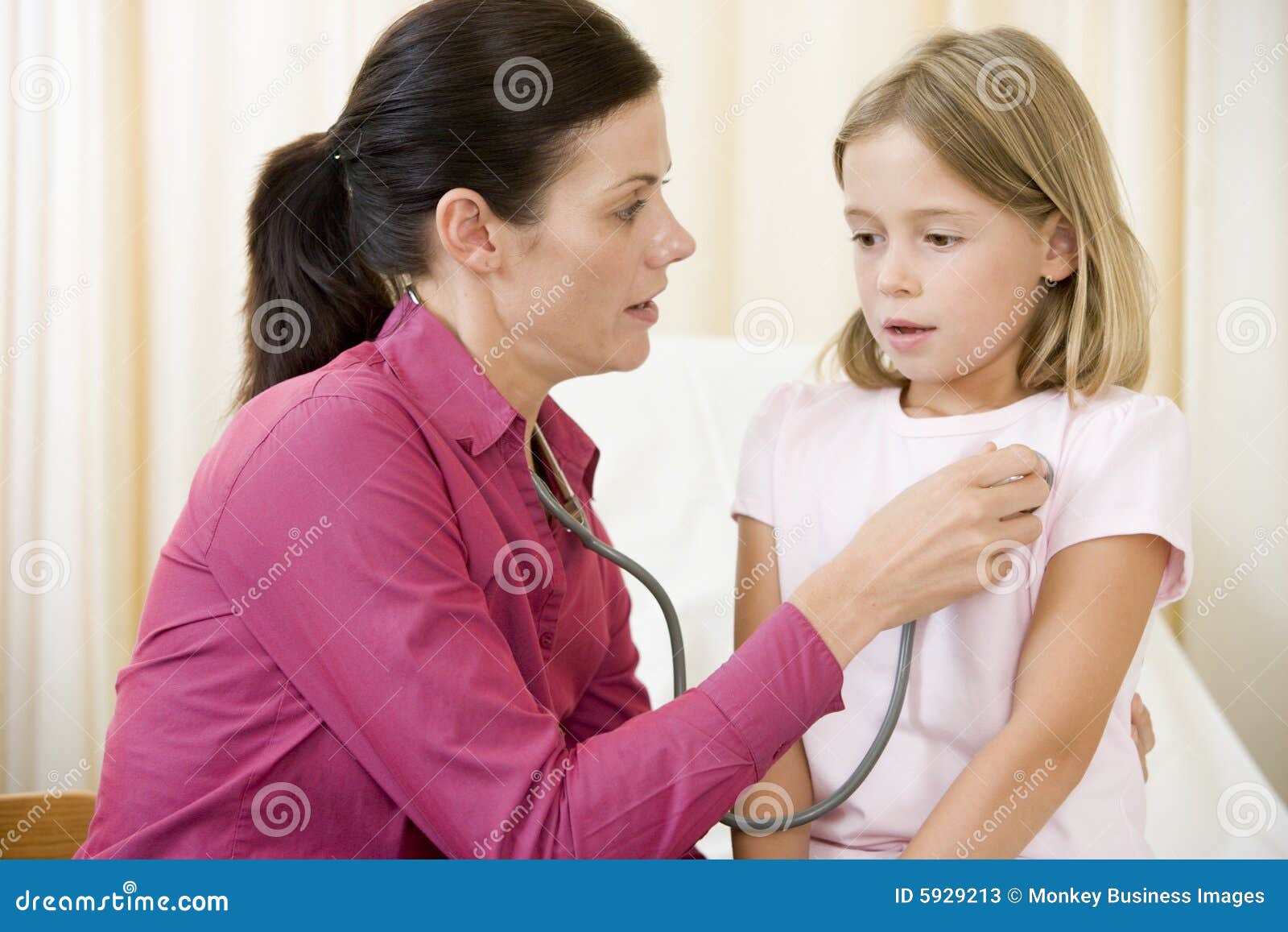 doctor giving checkup with stethoscope