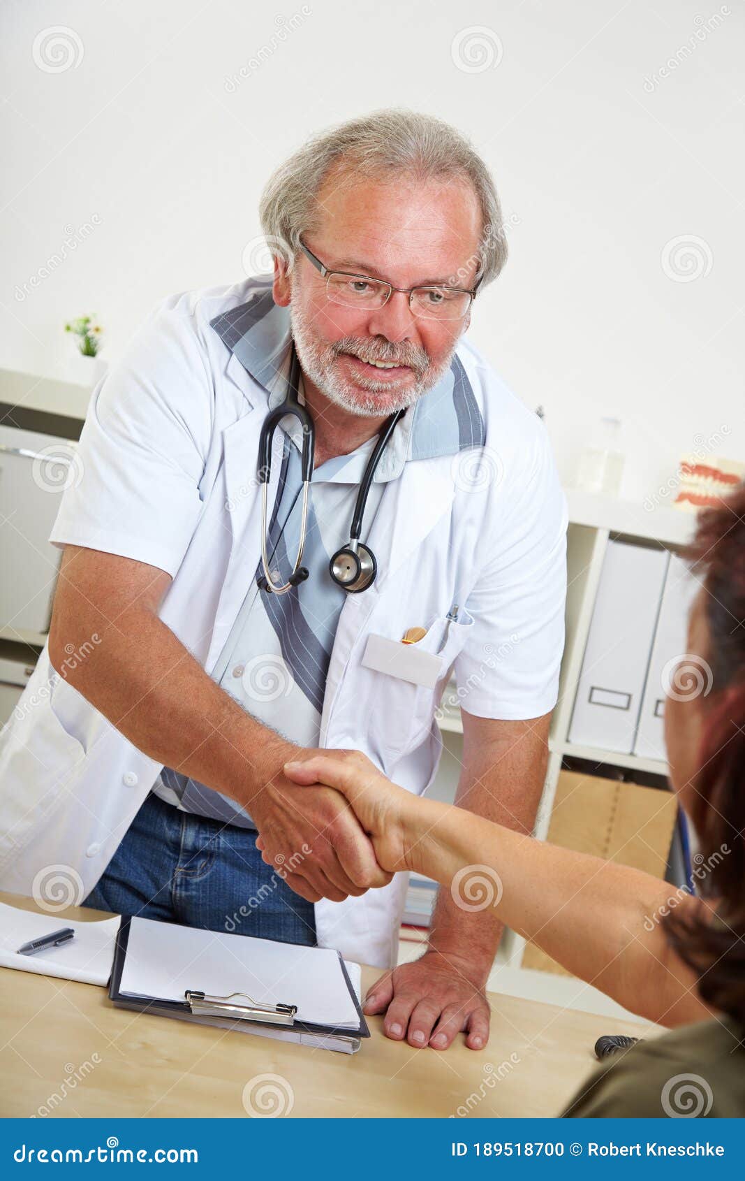 Doctor Greets Patient with Handshake Stock Photo Image of doctors