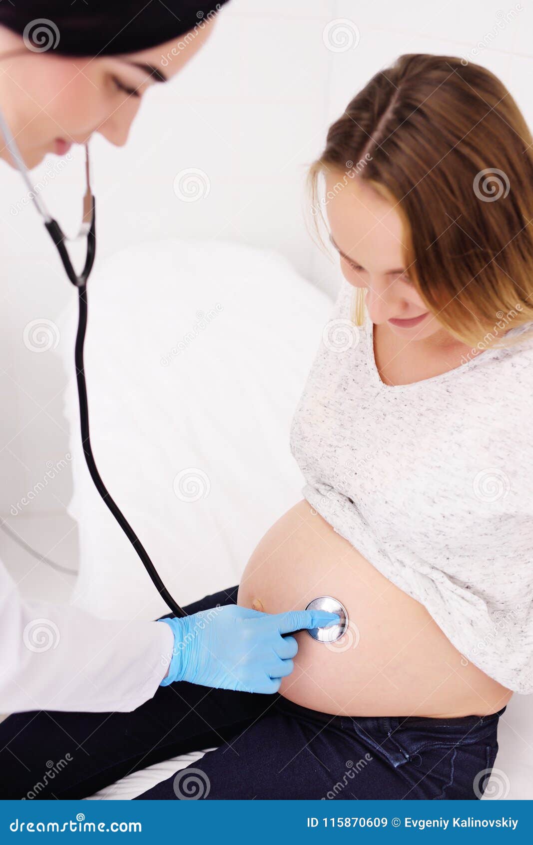Doctor Gynecologist Examines A Pregnant Woman With A Large Belly Stock 