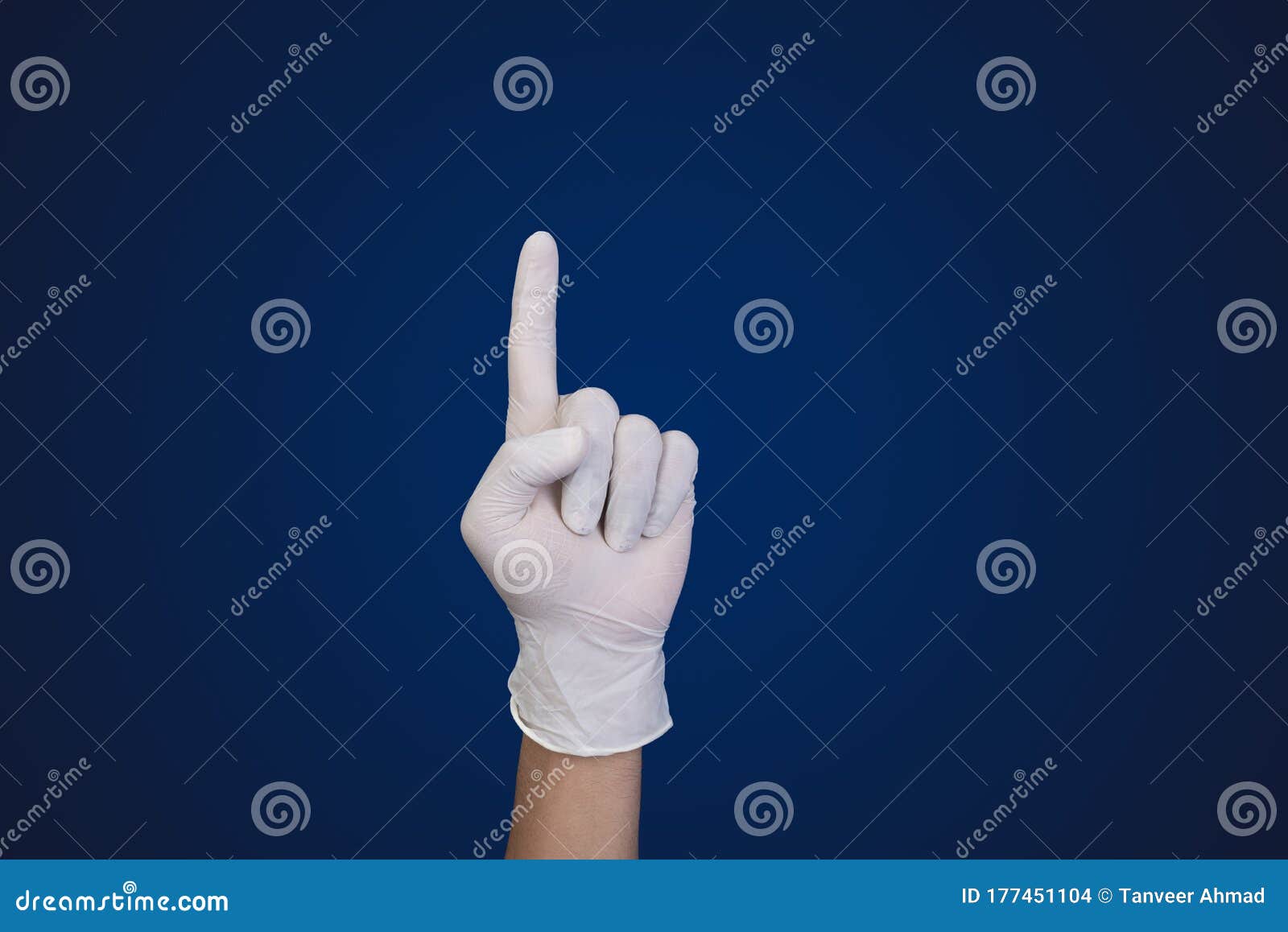Doctor Hand with Glove Pointing Up with Finger with Copy Space for Your