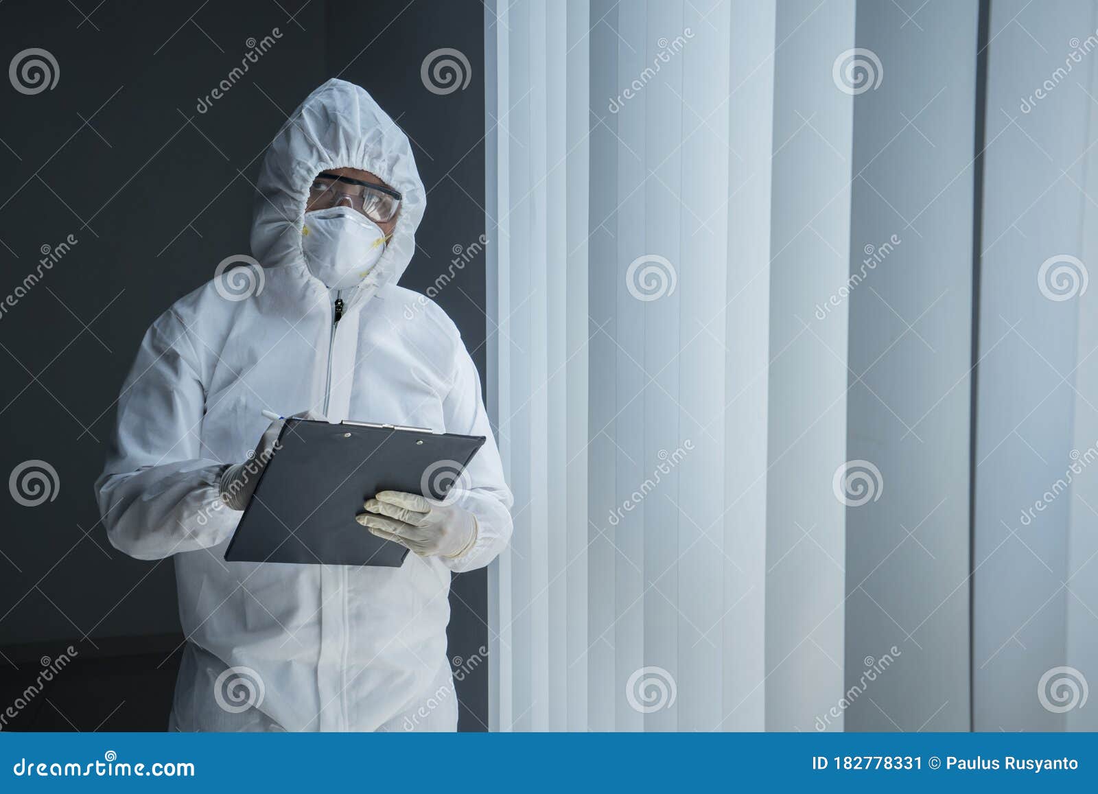 Doctor in Hazmat Suit Holds Clipboard in Hospital Stock Image - Image ...