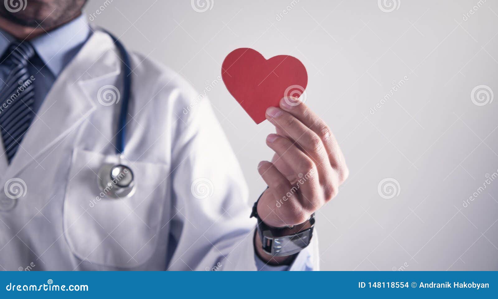 doctor holding red paper heart. healthcare and cardiology concept