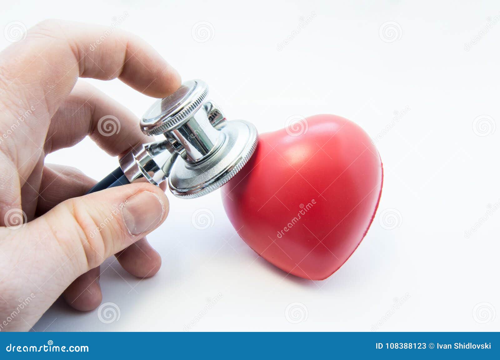 doctor holding stethoscope in his hand, examines heart  for presence of diseases of cardiovascular system. photo for use in c