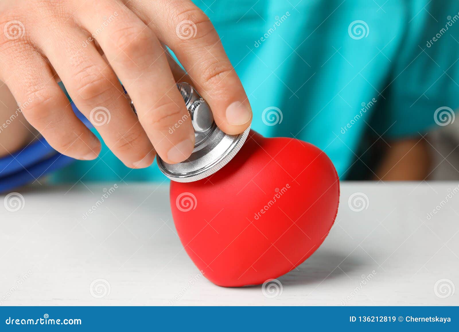 Doctor Holding Stethoscope Near Red Heart On Wooden Table, Closeup. Stock Image - Image of ...