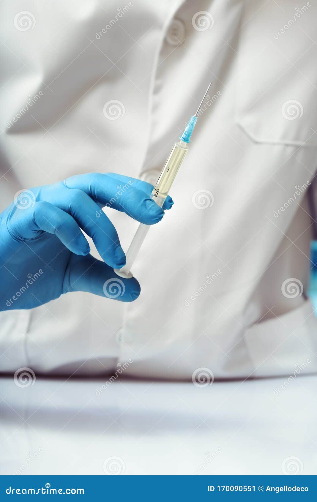 doctor holding a subcutaneous vaccine of preventive medicine in the medical office