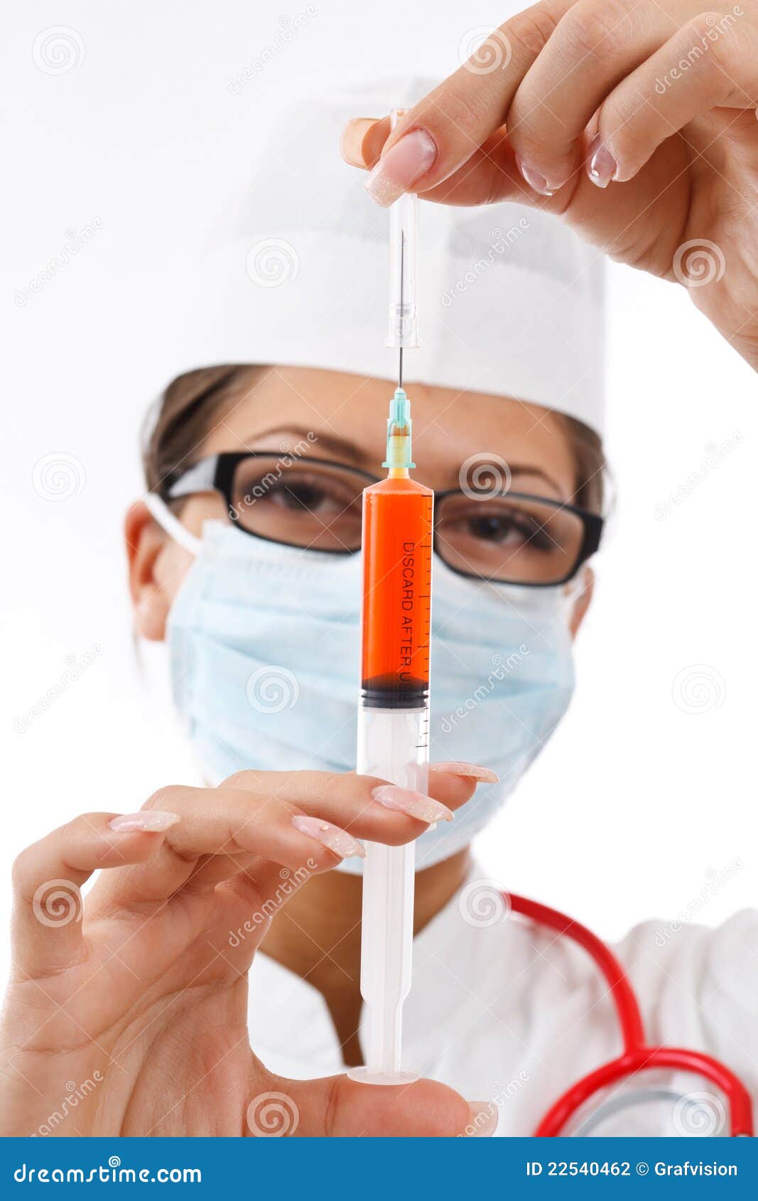 Doctor holding syringe. stock photo. Image of mature 22540462