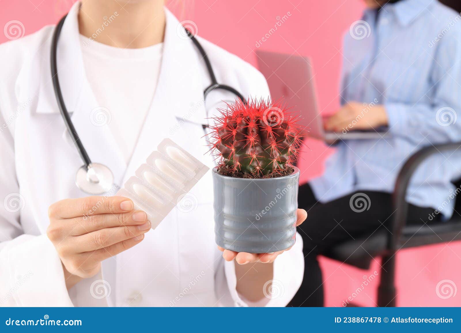 Doctor Holds Cactus and Suppositories. Hemorrhoids Concept Stock Photo