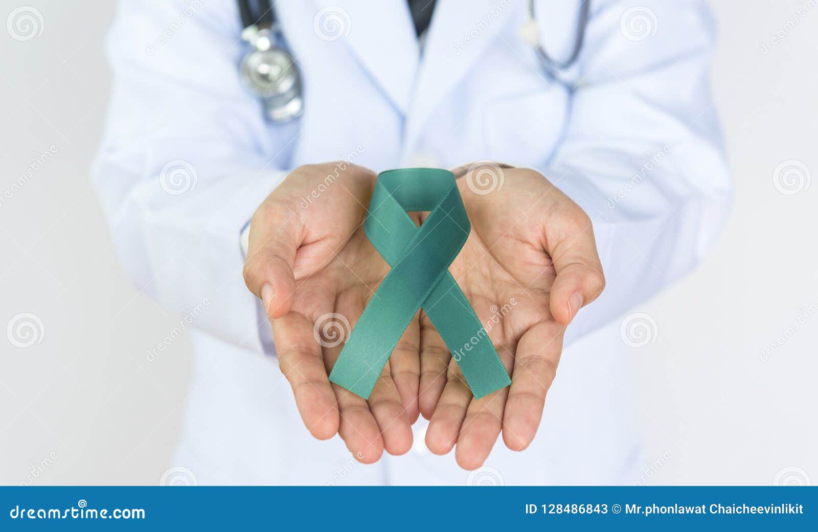 doctor holds green ribbon