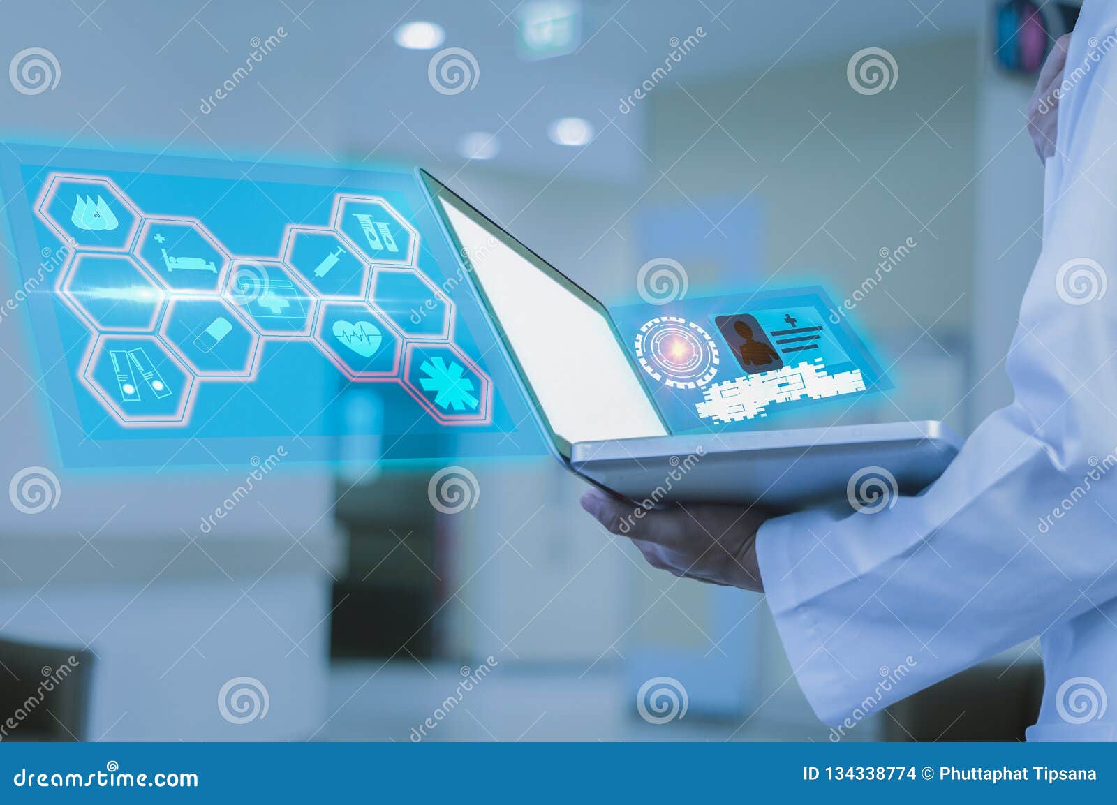 doctor holds a laptop in hand in hospital, analyze symptoms of patient to use as information in treatment of illness, of
