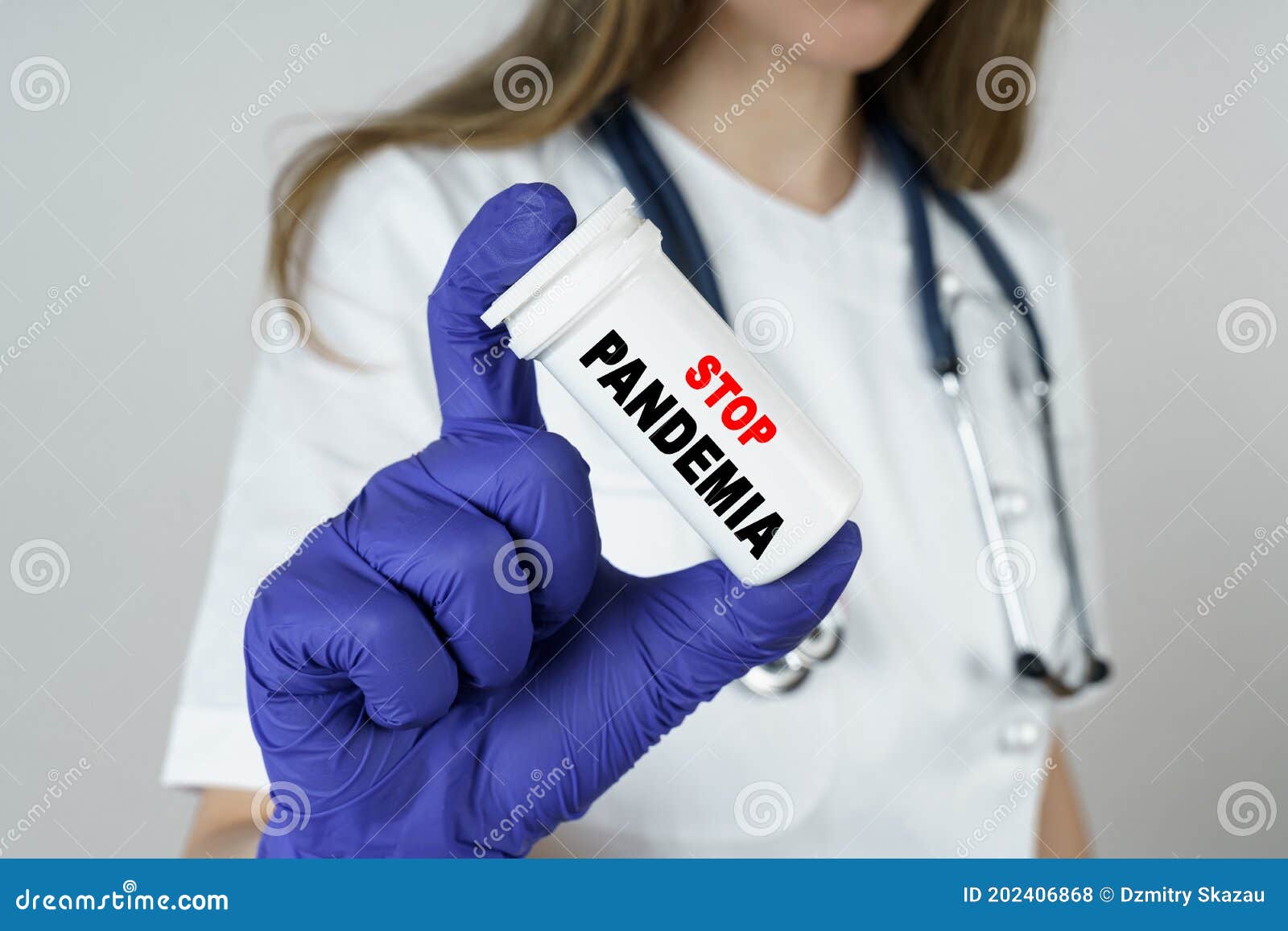 the doctor holds a medicine in his hands, which says - stop pandemia