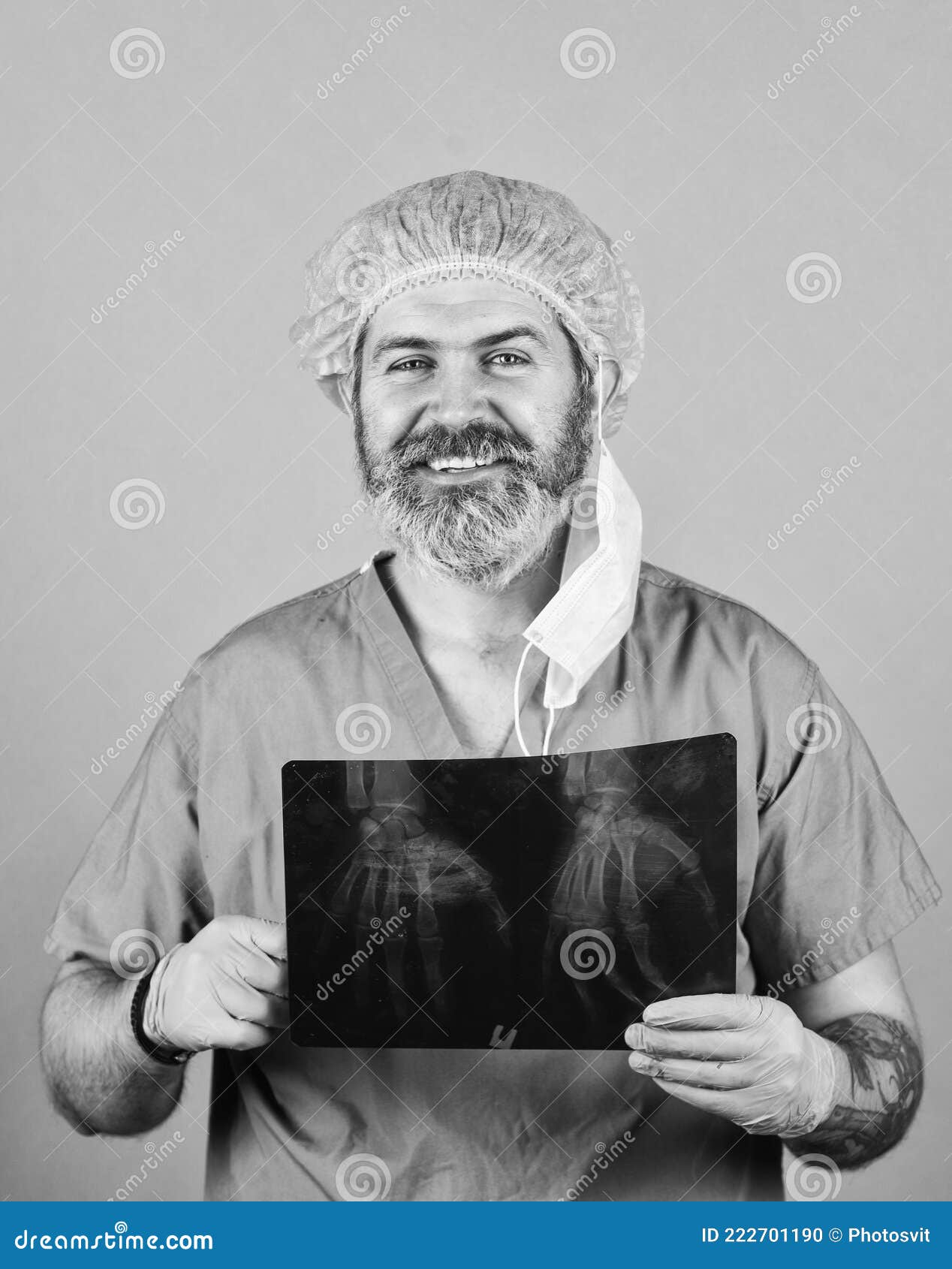 doctor holds pictures of bones. fracture and bone damage. doctor examines radiographic snapshot of wrist. surgeon