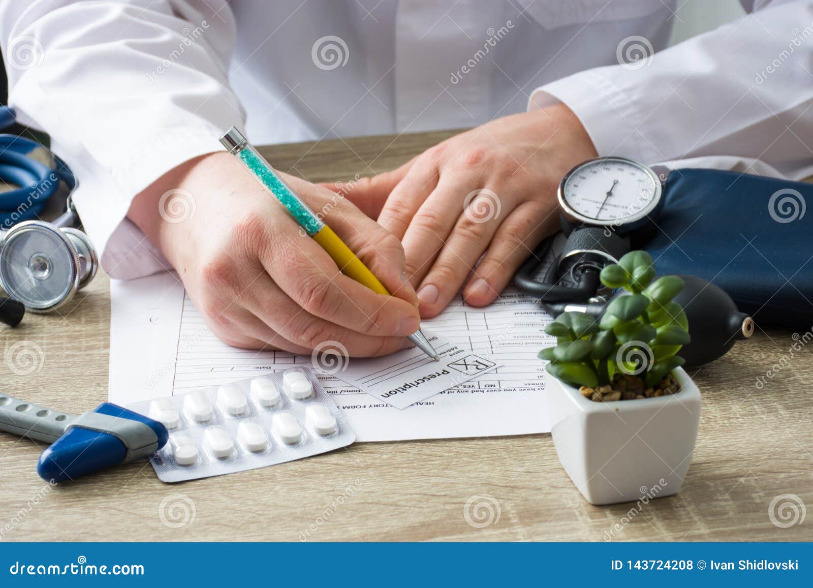 doctor in hospital office prescribe prescription medication to patient who came to appointment. control and monitoring of dischar